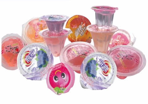 Cup filling and sealing machine for jelly